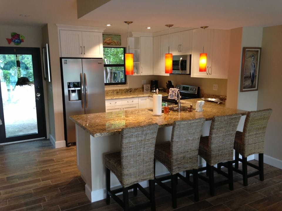 Brand new kitchen with granite, stainless steel appliances & custom cabinets.