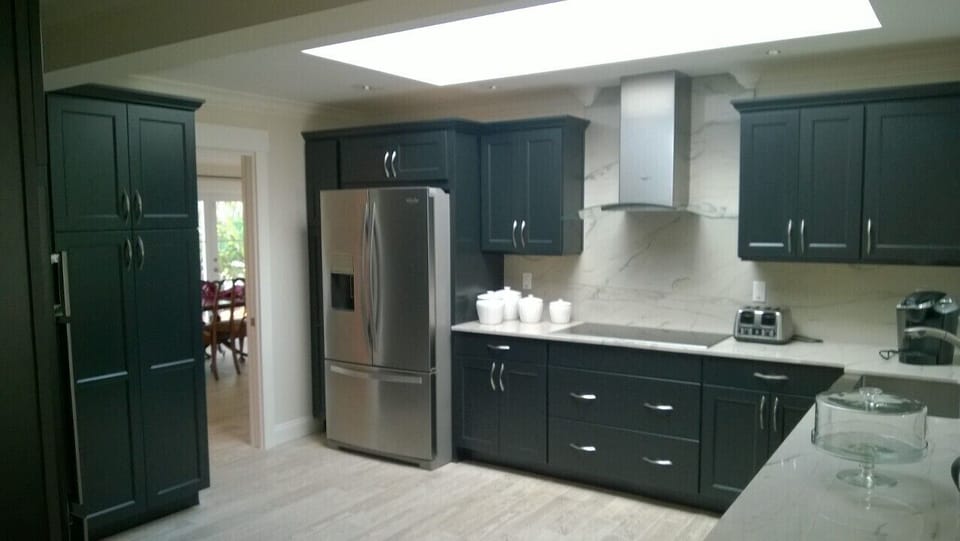 Newly-renovated kitchen with granite, huge pantry, & stainless appliances