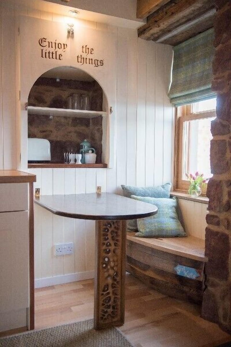 The dining table, seating for two people , an additional chair is provided. 