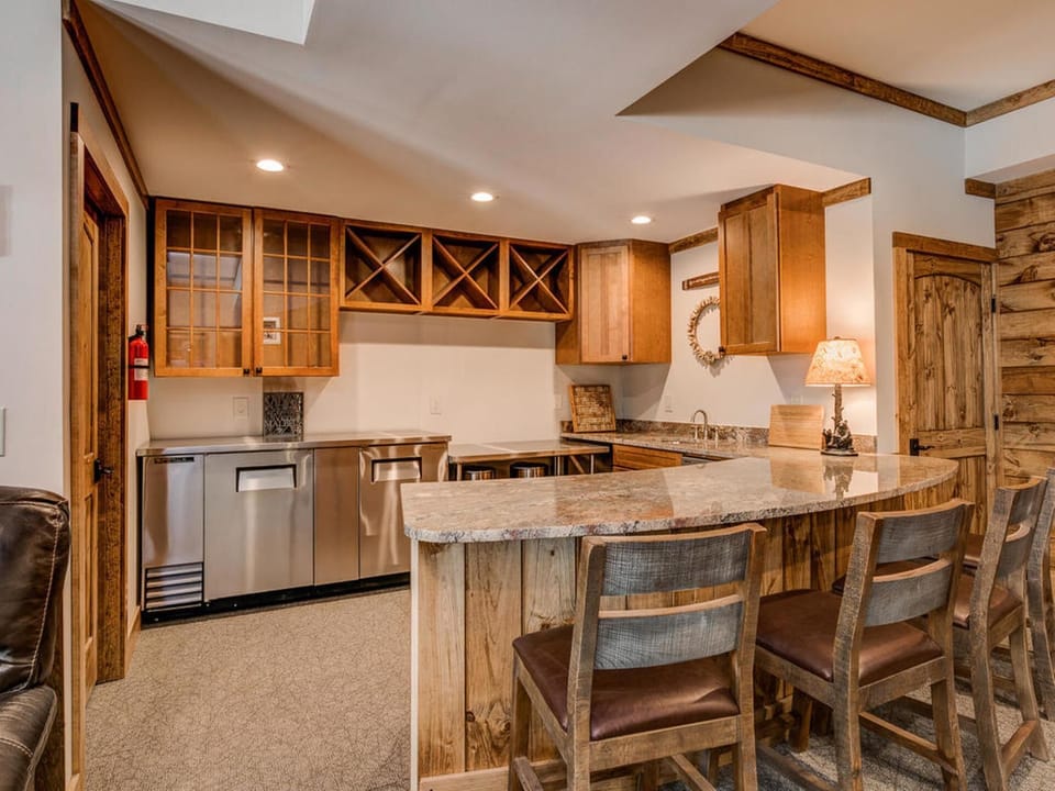 Basement bar with back bar cooler, sink and dishwasher