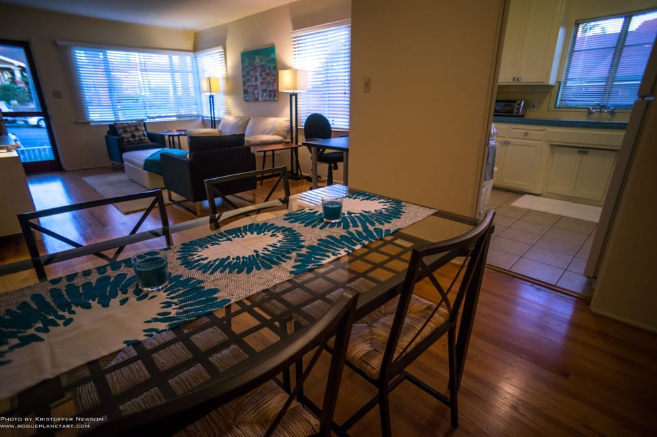 Dining area with peak view of desk at right.