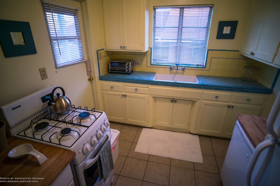 Bright kitchen with historic tile; new gas stove.