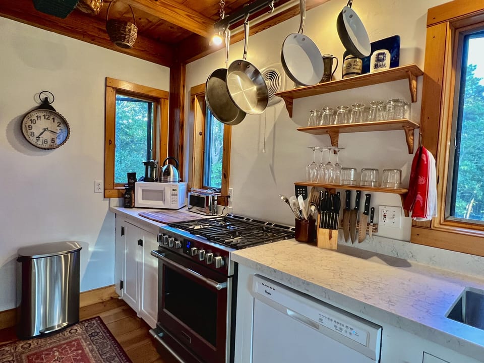 Chef's galley kitchen with 6-burner gas stove and all kitchen utensils/cookware