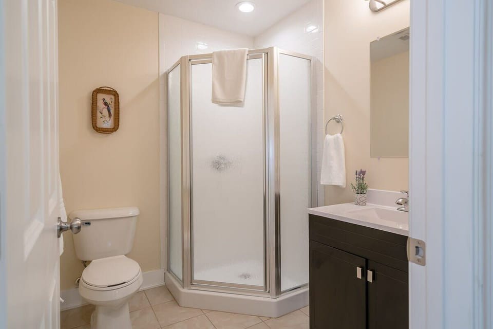 Full Heron's Landing bathroom, with corner glass shower (bathroom 3 of 4)