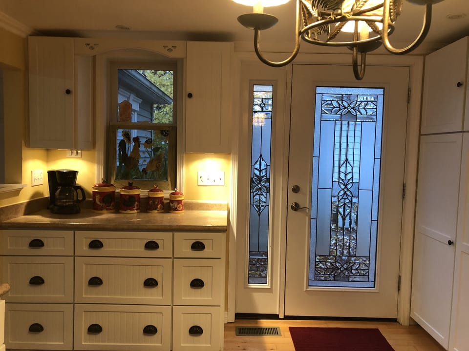 Kitchen door opens to back deck w/large grill and Blackstone to make meals easy!