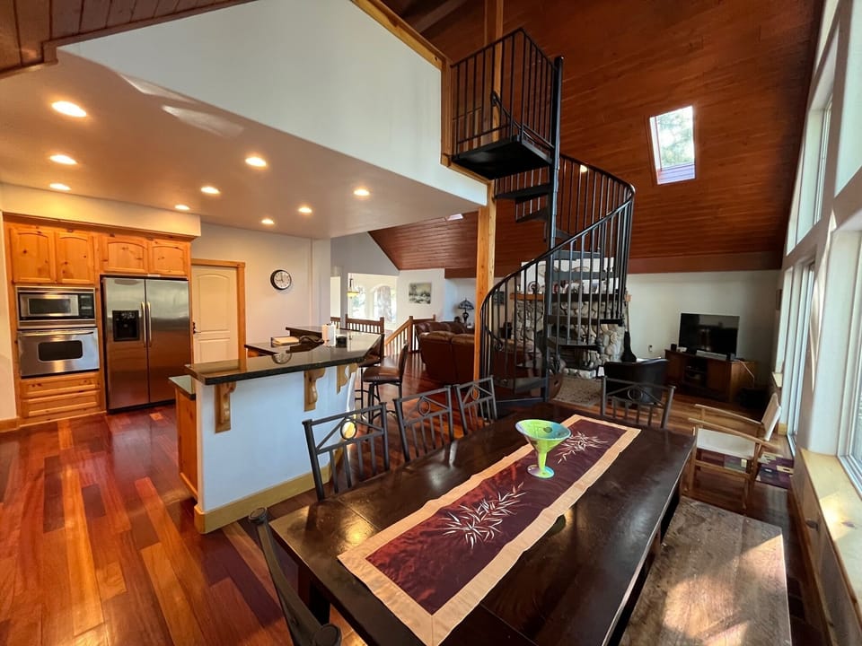 dining room and open concept stocked kitchen