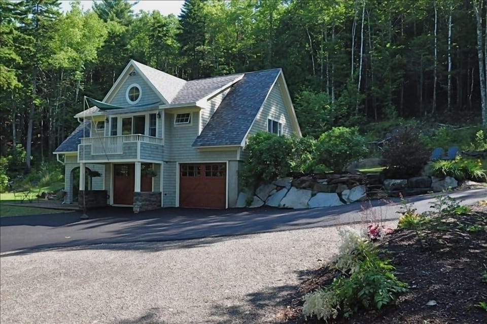 Carriage House and surrounding gardens and parking area.