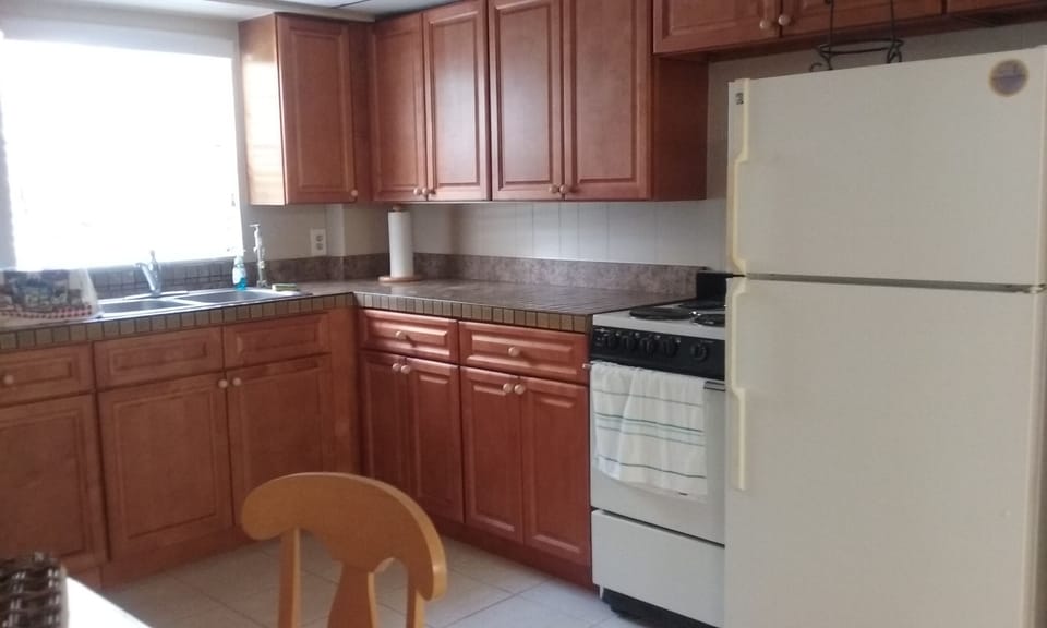 Full kitchen with full refrigerator, stove, oven, microwave, toaster oven, etc.