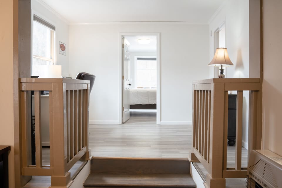 Stairs to both bedrooms, primary office/nook and back patio