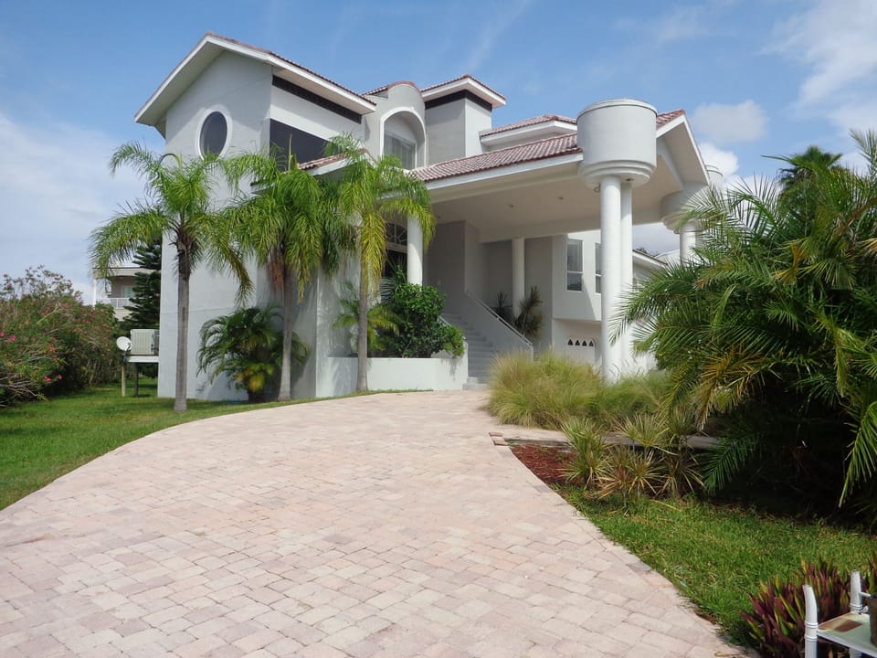 Side view of front of home.  Circular driveway.