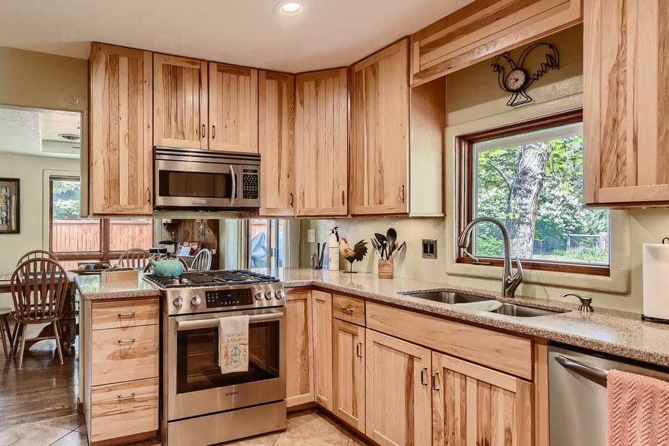Fully stocked kitchen with  cooking, baking and grilling utensils 