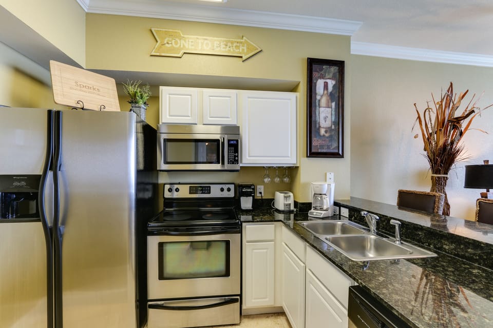 Fully stocked kitchen with stainless steel appliances
