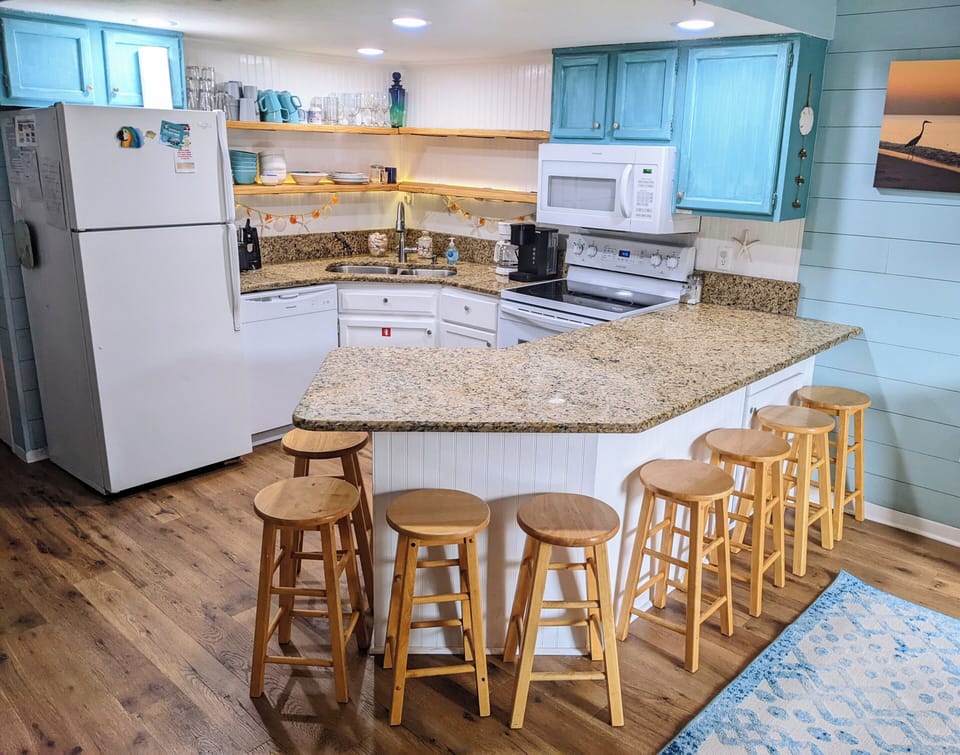 lots of seating around the granite breakfast bar!