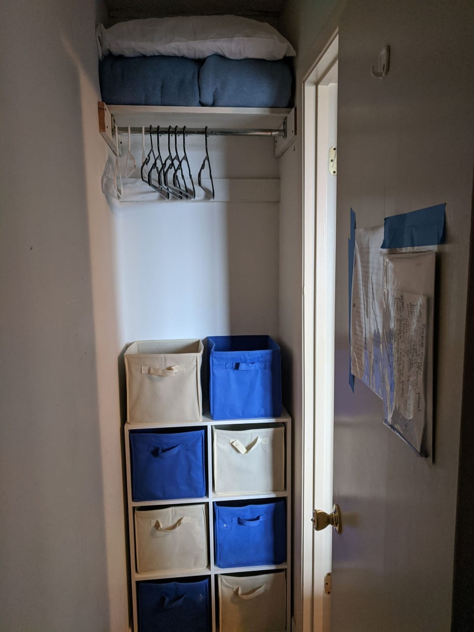 bunk room closet has plenty of cubbies for storage and a small area with hangers