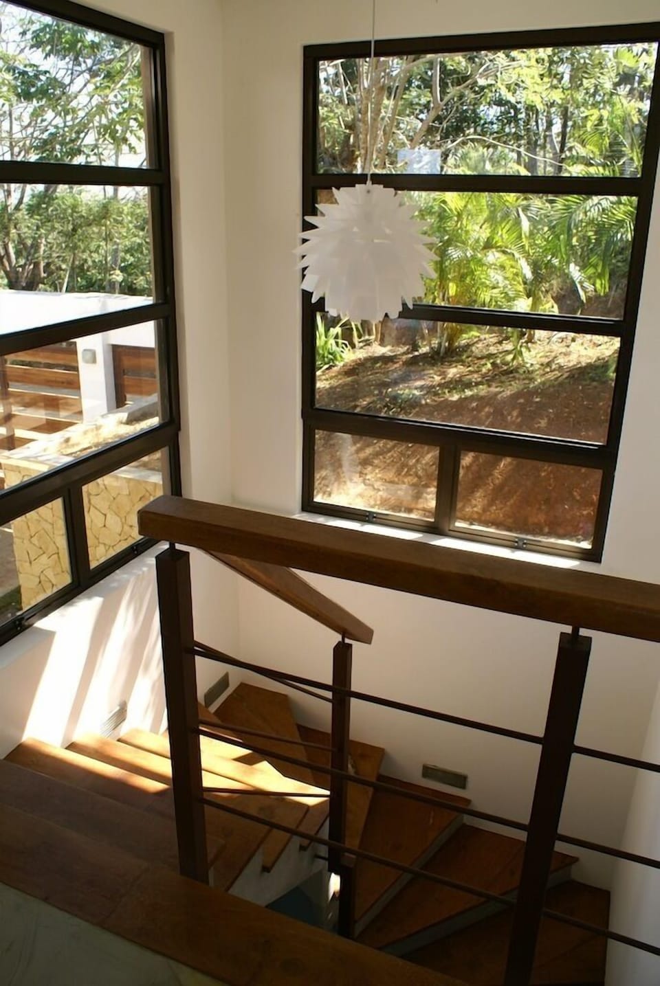 Stairway leading down to two bedrooms, bathroom and laundry room.