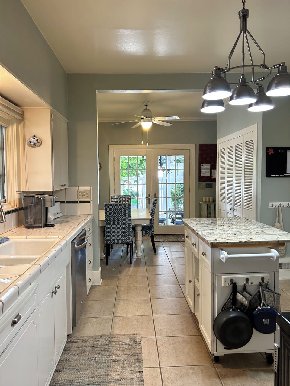 Sunny kitchen with access to courtyard. Laundry in the closet!