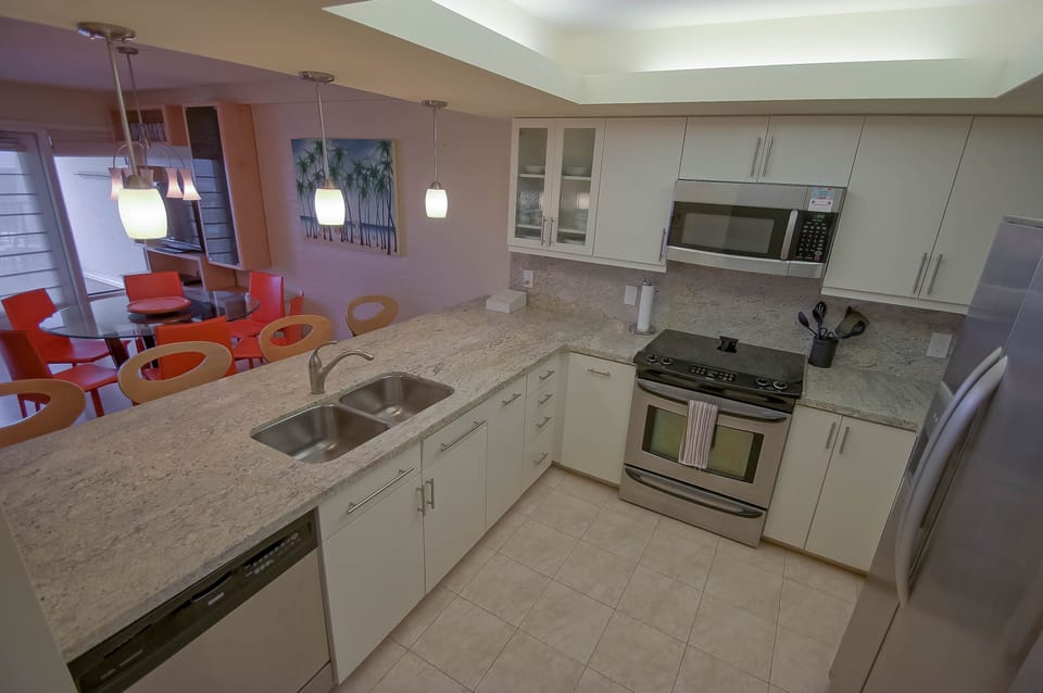 Updated kitchen w/ granite and stainless steel appliances.  