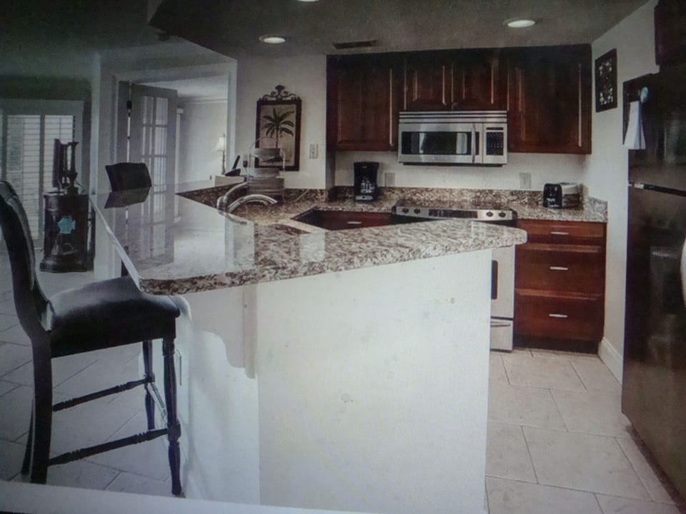 stocked kitchen with new granite and appointments 