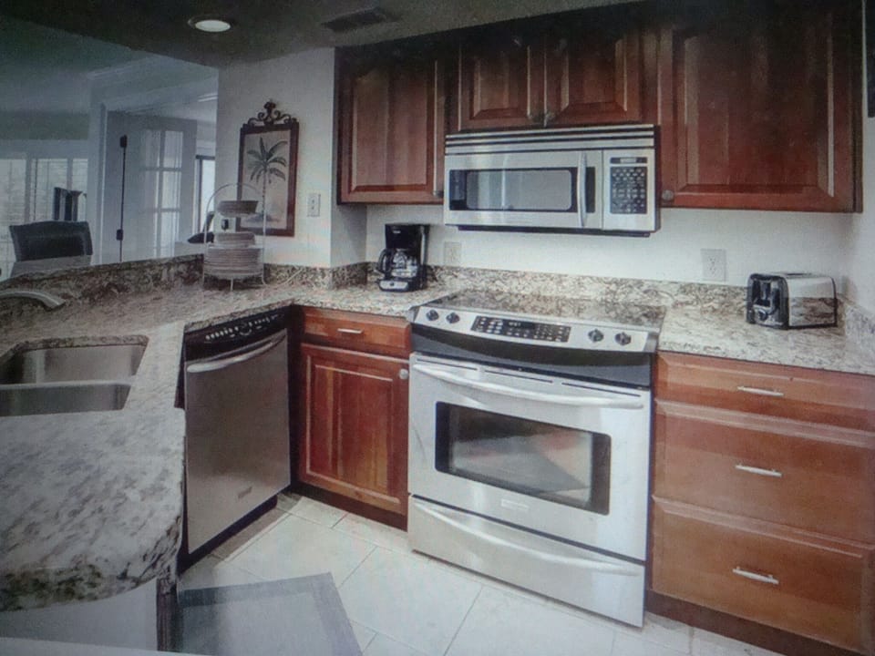 Open kitchen, granite counters, dish washer, convextion oven, cherry solid wood 