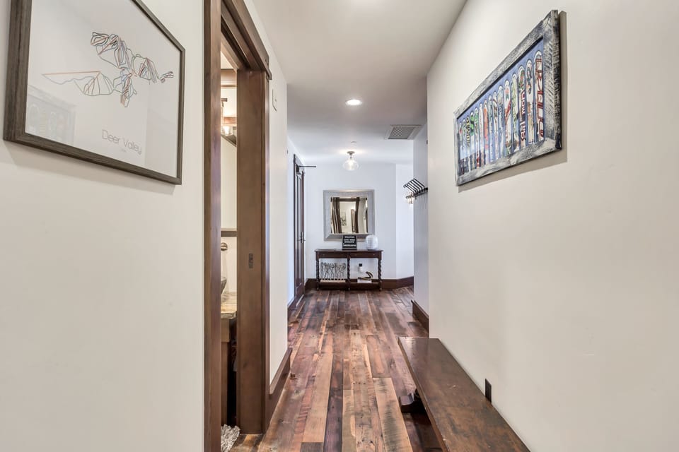 Powder room in hall w/laundry and extra bench seating for shoes, etc. 
