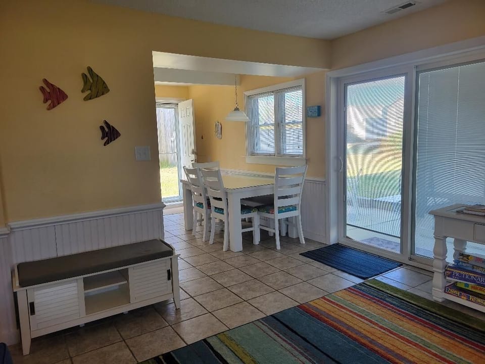 Lower level eating area in kitchen. Table has bench under the table.