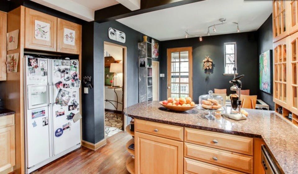 Kitchen has bar seating as well as a 4-top table