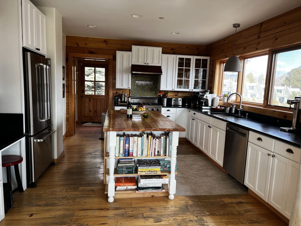 Open, well-appointed kitchen. View from dining room to kitchen.