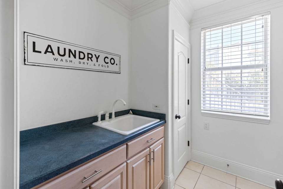 Your dedicated laundry space features elegant granite countertops and custom cabinetry, making wash day feel less like a chore.