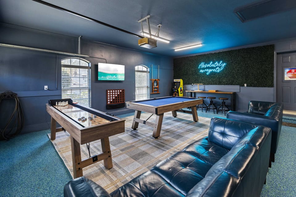 Step into your ultimate game room where friendly competition awaits with pool tables, arcade games, and cozy leather seating.