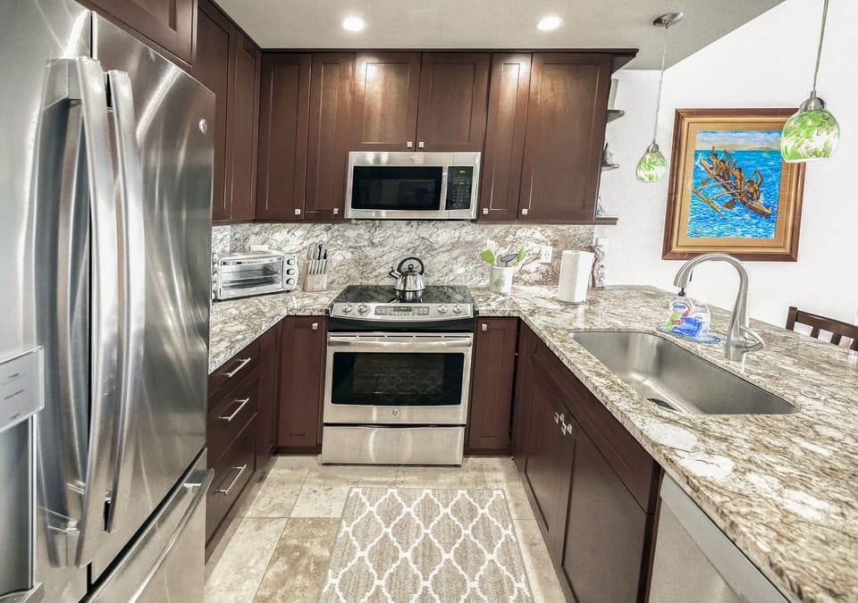 Fully equipped kitchen with quiet dishwasher and filtered water and ice. 