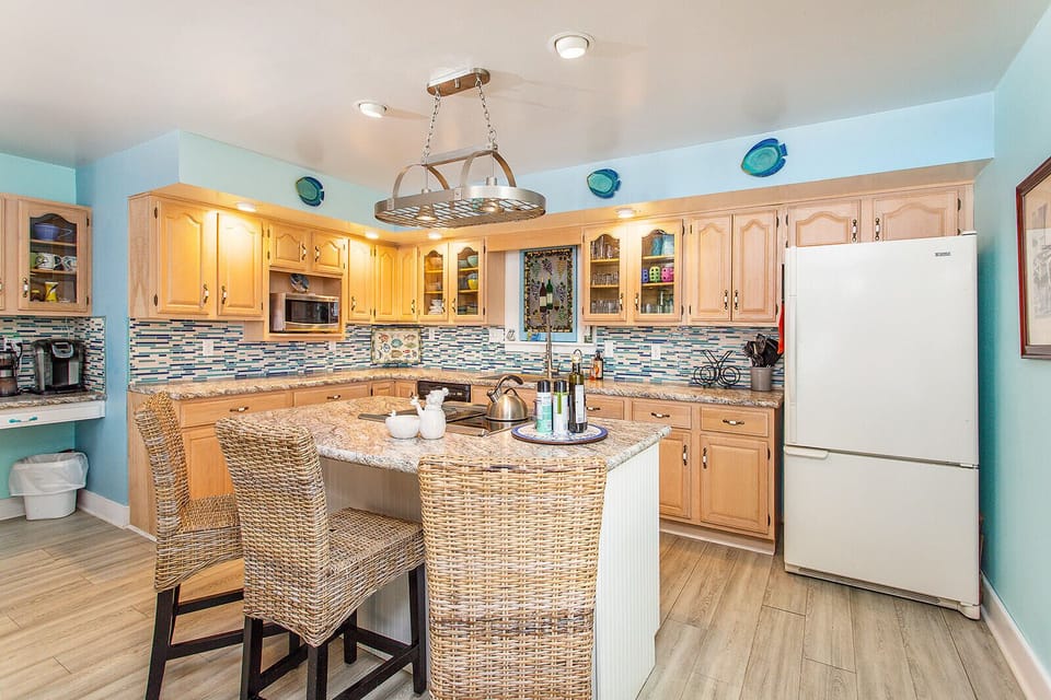 Fully stocked kitchen with new countertops, stove/oven and coffee bar