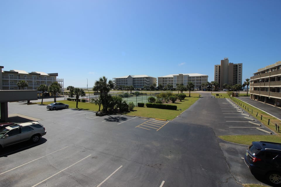 Tennis Court.  Across the street to the left is Dolphin Key to access beach!