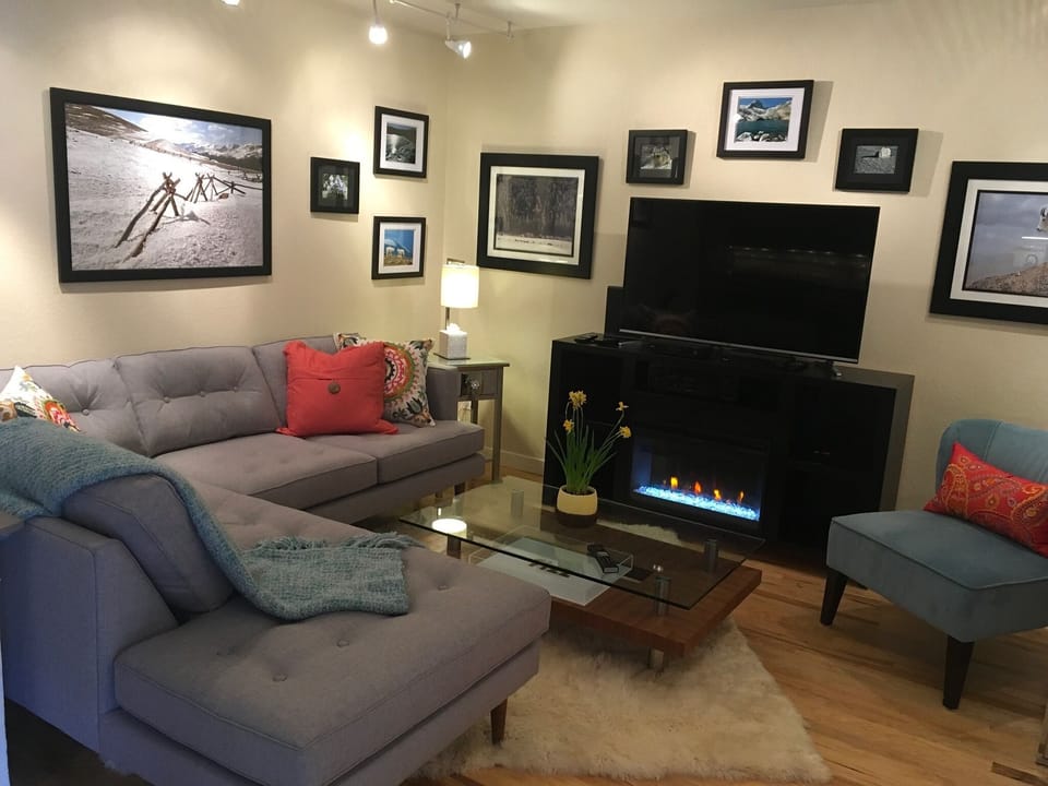 Colorado Themed Living Room with Entertainment Center and Electric Fireplace
