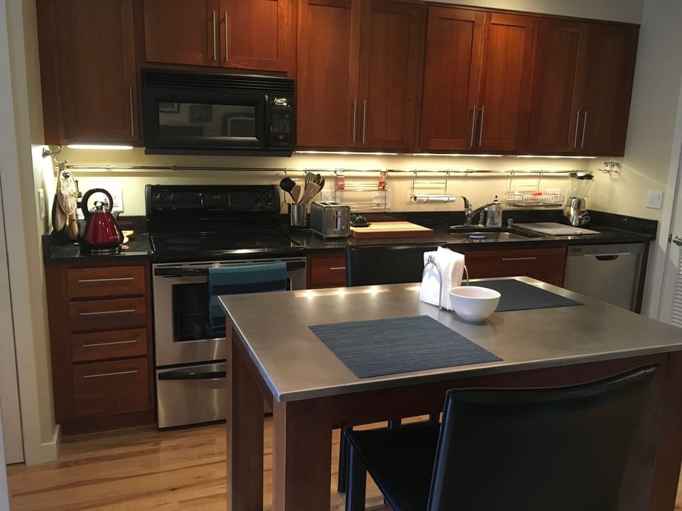 Updated Kitchen With Stainless Appliances and Granite Counters

