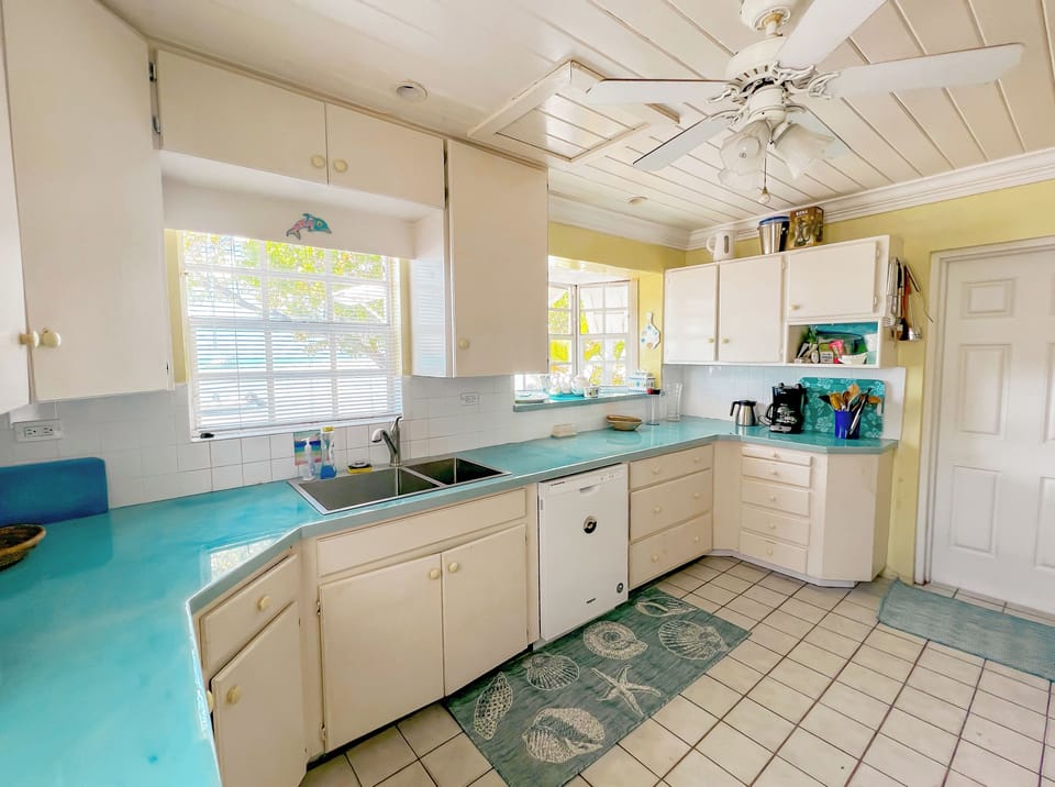 Fully-stocked kitchen with bay views and a mobile cutting board