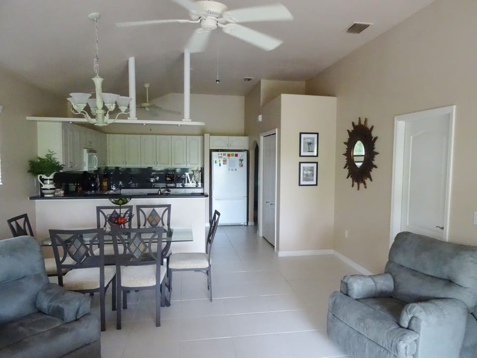 Open floor plan with kitchen, dining and living room areas