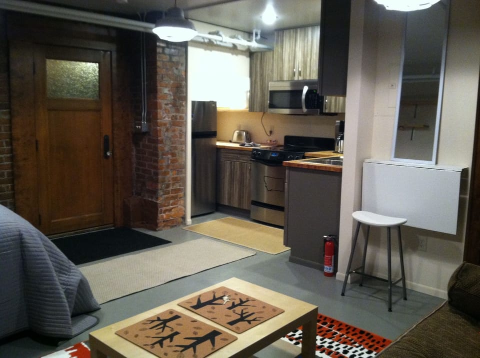 Studio's entry door and kitchen.