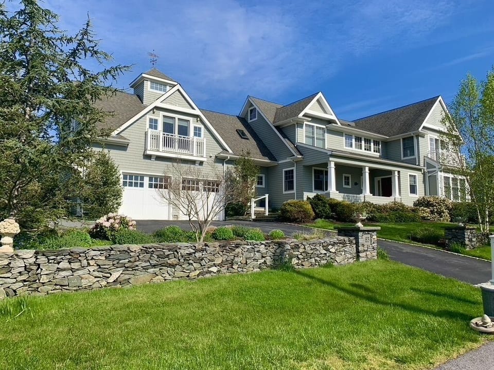 Street view. Main house with attached carriage house apartment at left.