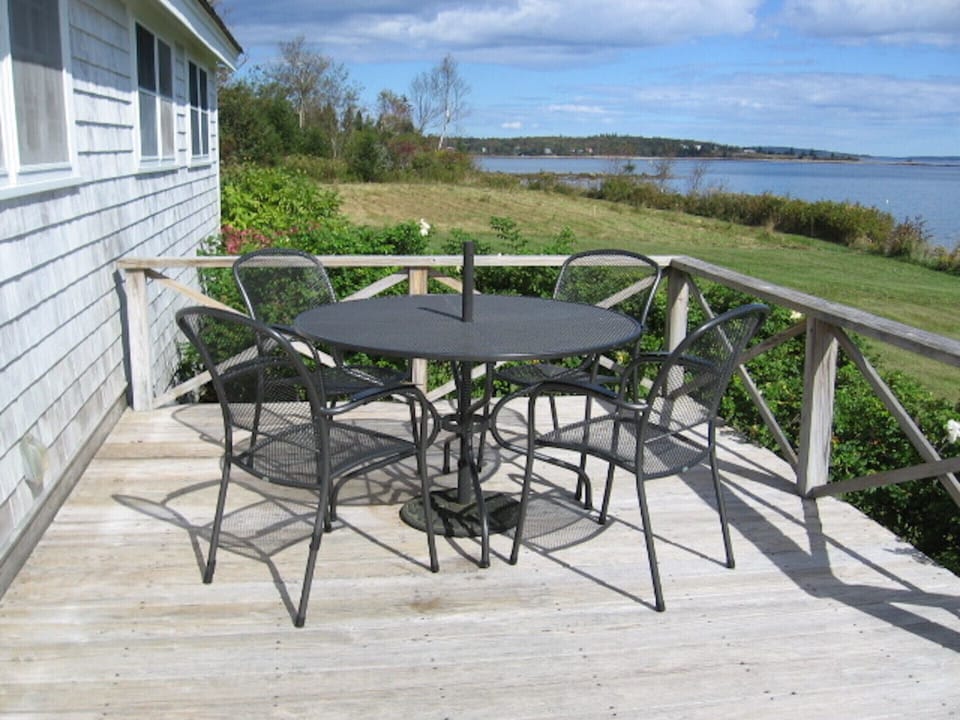 Outdoor dining table on the oceanside deck (photo taken in late September)