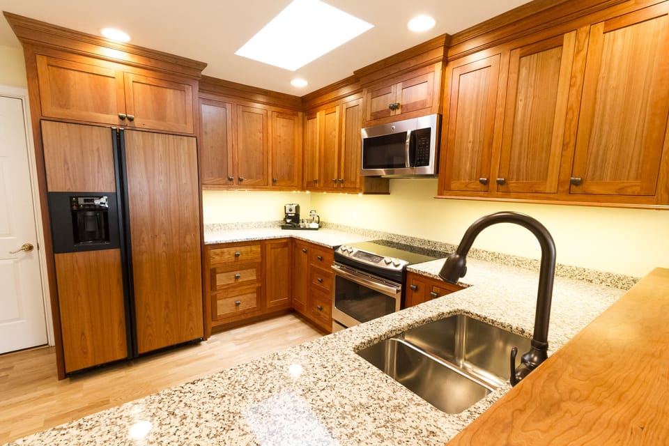 Kitchen: Fully stocked. Custom cabinets and granite countertops.