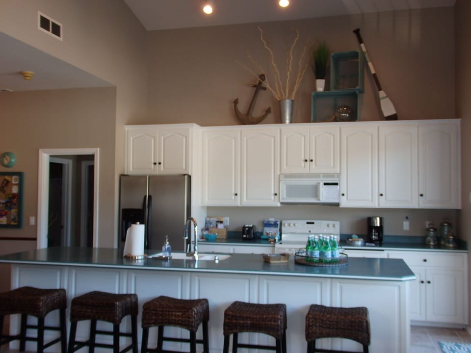 Kitchen with large center island, bar stools