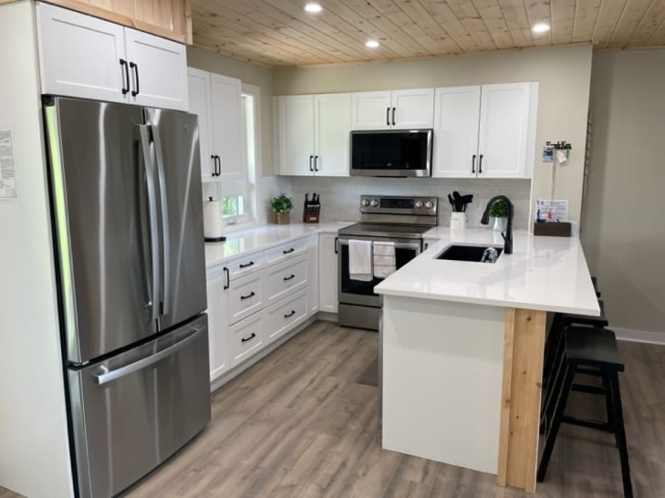 Kitchen fully equipped with new full size fridge and stove and all amenities