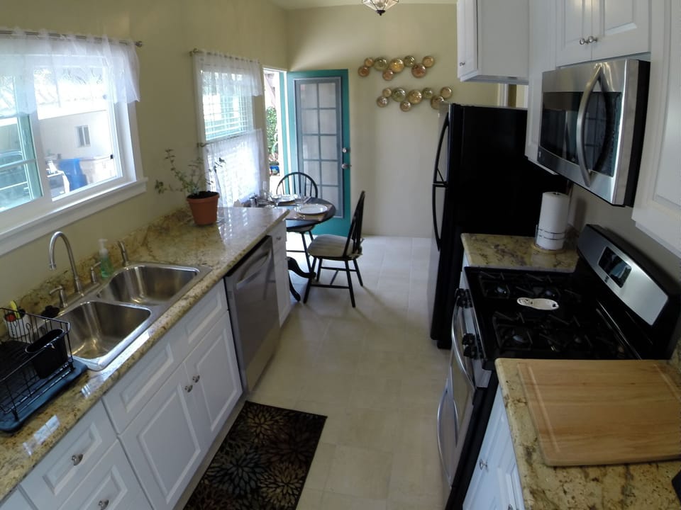 kitchen (continued) door to backyard patio- dining is possible in and outdoors