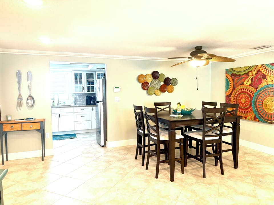 Large counter height dining table seats 6 (or 8 with adding kitchen chairs).