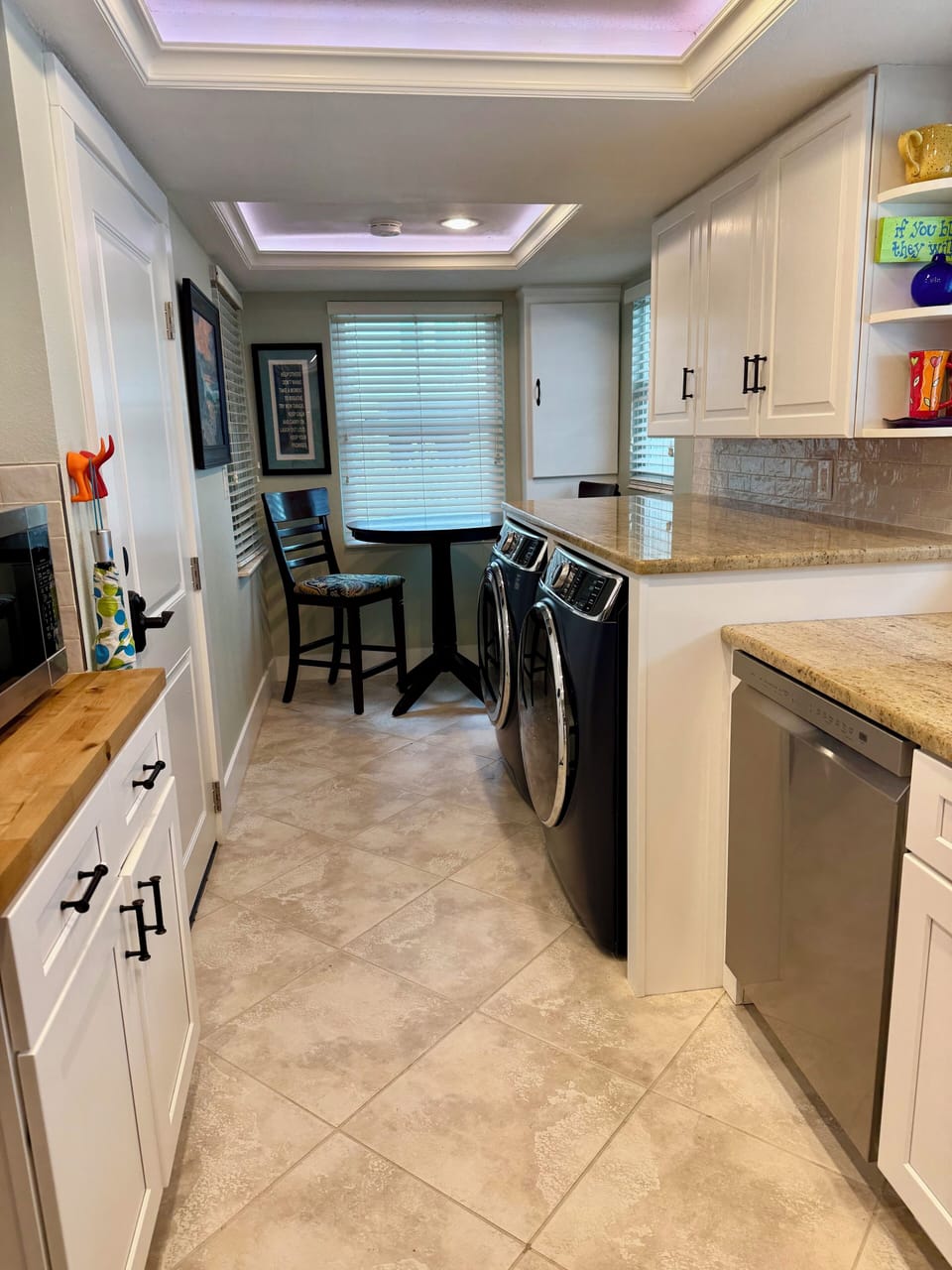 Fully equipped kitchen with all new appliances and breakfast nook.