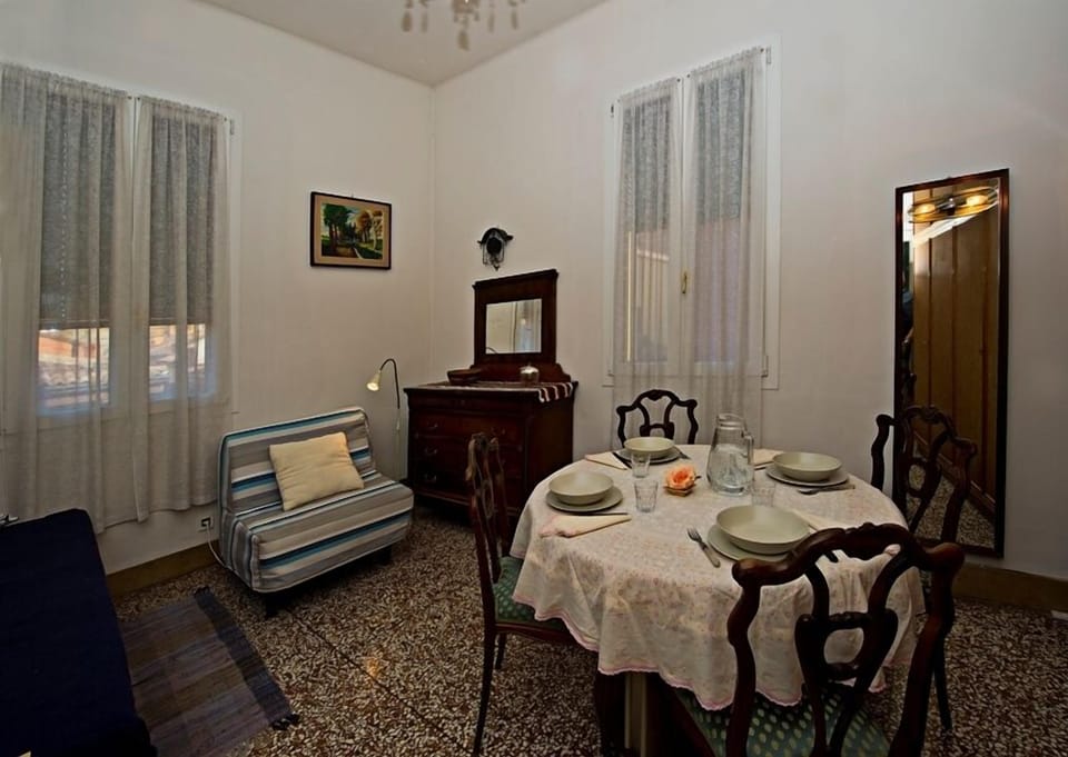 Most bedroom windows overlook a quiet, typical Bolognese backstreet.