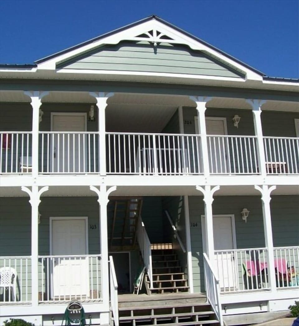 View from front of complex; entrance to this unit is second floor; center unit.