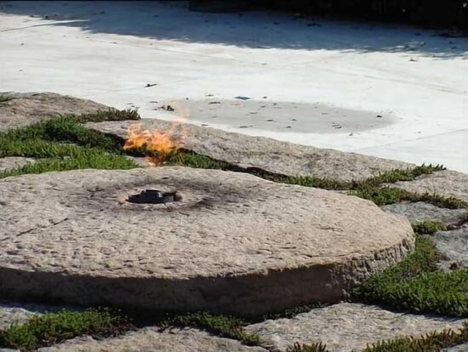 The Eternal Flame Burns over the Grave of John F. Kennedy. RIP