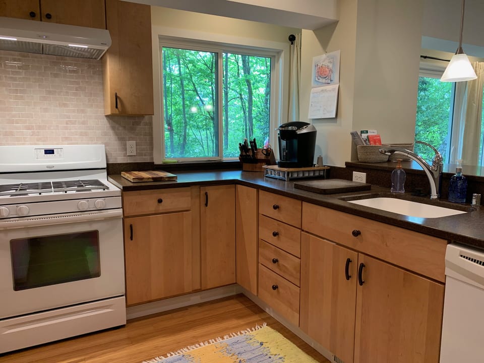 Fully equipped kitchen with stocked Keurig and pantry with staples