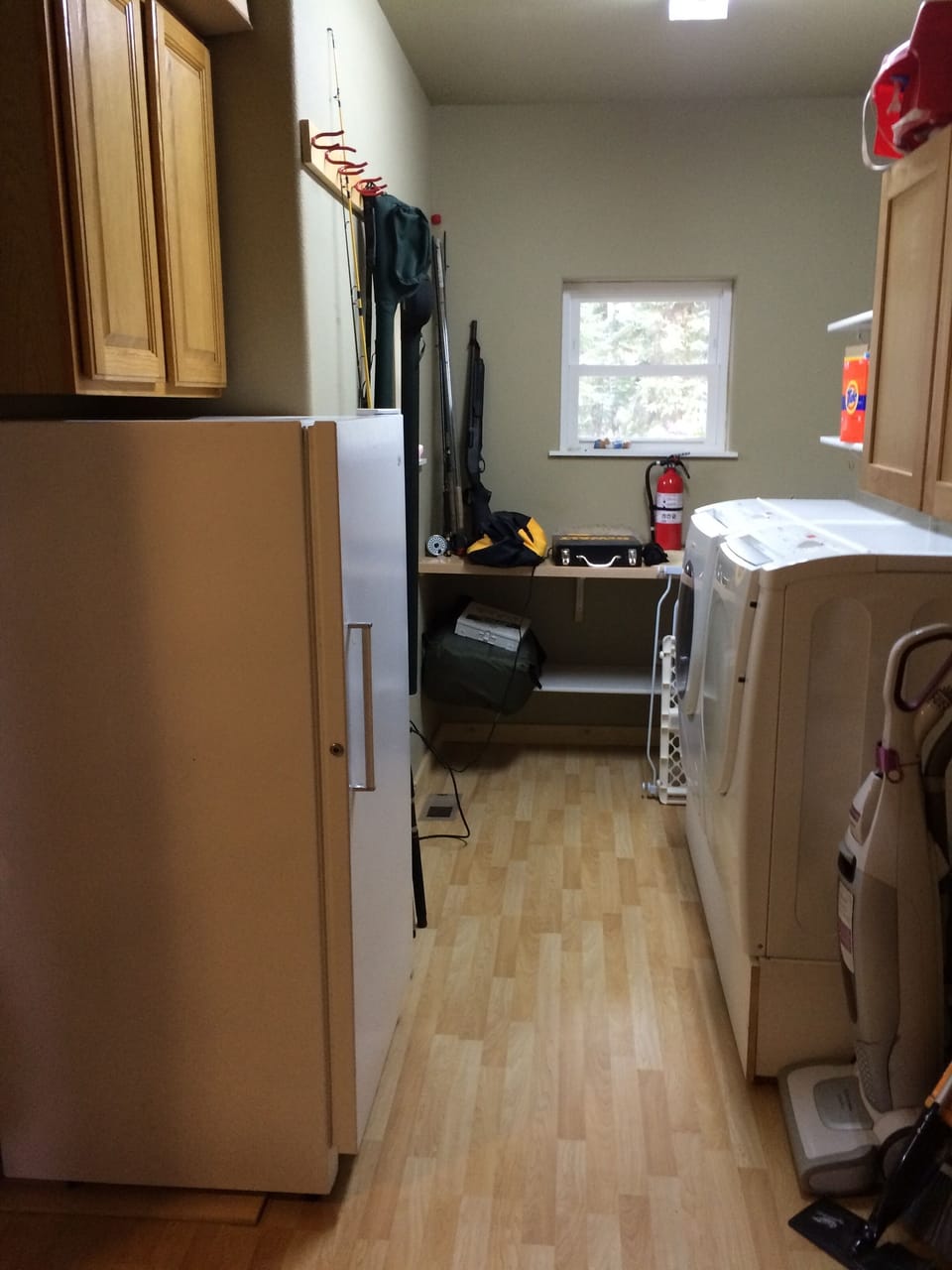 Laundry area with full size freezer for your bounty.